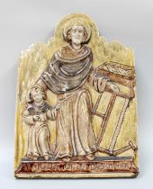 A Glazed Earthenware Religious Wall Plaque, inscribed "St Jozef onze Beschermer", impressed St