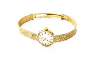 A Lady's 9 Carat Gold Wristwatch, signed Tissot Lot 465, weight is 14.6g. Winding smoothly, movement