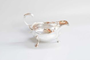 A George III Silver Sauceboat, by David Hennell and Robert Hennell, London 1763, oval and on three