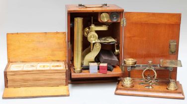 An Edwardian Mahogany Cased Brass Microscope, and a case containing twelve trays of slides, labelled