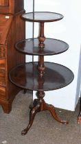 A George III Style Mahogany Three Tier Dumb Waiter, on carved cabriole supports, lower tier 61cm