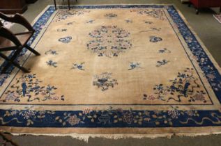 Walter Nichols Chinese Carpet, the champagne field decorated with floral sprays and butterflies