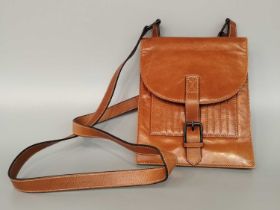 Circa 1990s Yves Saint Laurent Tan Leather Cross Body Bag, with stitched ribbed pocket to the front,