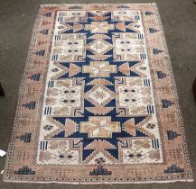 Rug of Lesghi Design, the ivory field with three typical stars enclosed by borders of geometric