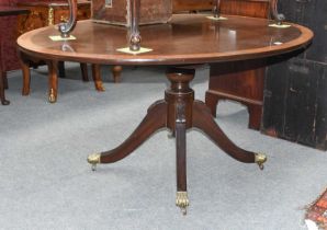 A Reproduction Crossbanded Mahogany Oval Loo Table, by Gott's, Pickering, on a turned supports