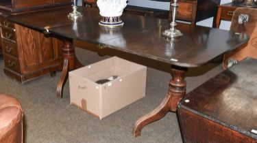 A Mahogany D-End Dining Table, early 19th century, with additional leaf and on reeded scroll