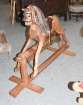 A Modern Unpainted Rocking Horse, with leatherette tack on a treadle base