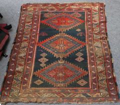 Shirvan Rug, the field with three serrated hexagons enclosed by pale lemon leaf and calyx borders,