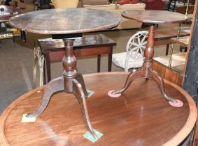 A George III Oak Tripod Table, with plank top and rotating on a bird cage mechanism, 68cm diameter