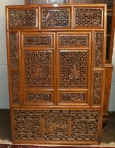 A 20th Century Chinese Fruitwood Window, with two hinged sections, the panels pierced and carved