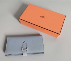 A Hermès Bearn Powder Blue Leather Wallet, comprising a zipped pocket, three open pockets, credit