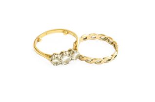 An 18 Carat Gold Diamond Three Stone Ring, the graduated round brilliant cut diamonds in white