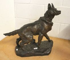 After Thomas François Cartier (1879-1943), a patinated spelter sculpture of a hound on