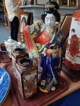 A Large Japanese Kutani Porcelain Figure of a Bijin, late Meiji Period/Taisho, 46cm in height;