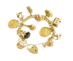 A Flat Curb Link Bracelet, suspending twelve charms including two sovereigns dated 1887 and 1958,