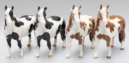 Beswick Pinto Ponies, comprising two Skewbald gloss examples and two Piebald (4)