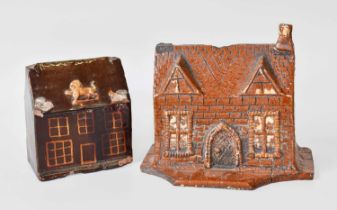 A Large 19th Century Yorkshire Moneybox, in the form of a house, together with another example,