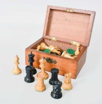 An Ebony and Boxwood Chess Set, the box stamped Feltam, London Complete set Black Knight has been