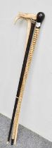 A 19th Century Shark Vertebrae Walking Cane, ebony knop and ferrule, 90cm length; together with a