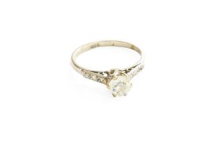 A Diamond Solitaire Ring, the old cut diamond in a white claw setting, to diamond set tapered