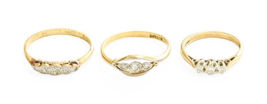 A 9 Carat Gold Diamond Three Stone ring, the graduated round brilliant cut diamonds in white claw