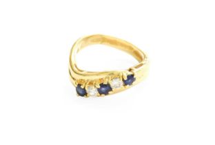 A Sapphire and Diamond Five Stone Twist Ring, three round cut sapphires alternate with round