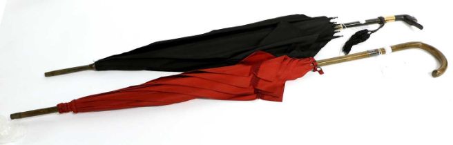 Two Early 20th Century Parasols, comprising a Brigg, London novelty example with red silk mount,