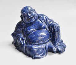 A Chinese Carved Lapiz Lazuli Sculpture of Hotei, in seated pose, 9cm high Numerous chips and