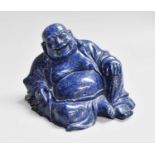 A Chinese Carved Lapiz Lazuli Sculpture of Hotei, in seated pose, 9cm high Numerous chips and