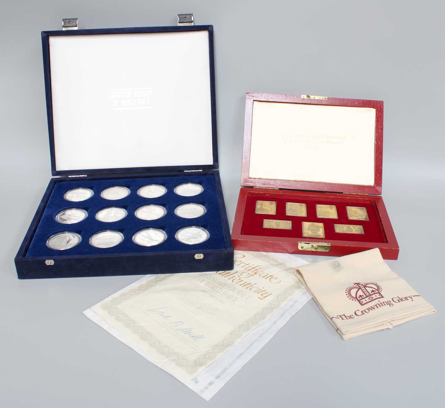 Two Silver Commemorative Sets, comprising 'The Crowning Glory', a cased set of silver-gilt replica