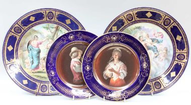 A Pair of Vienna Style Porcelain Dishes, 20th century, ground in cobalt blue and gilded, printed