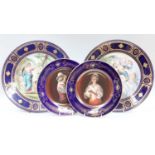 A Pair of Vienna Style Porcelain Dishes, 20th century, ground in cobalt blue and gilded, printed