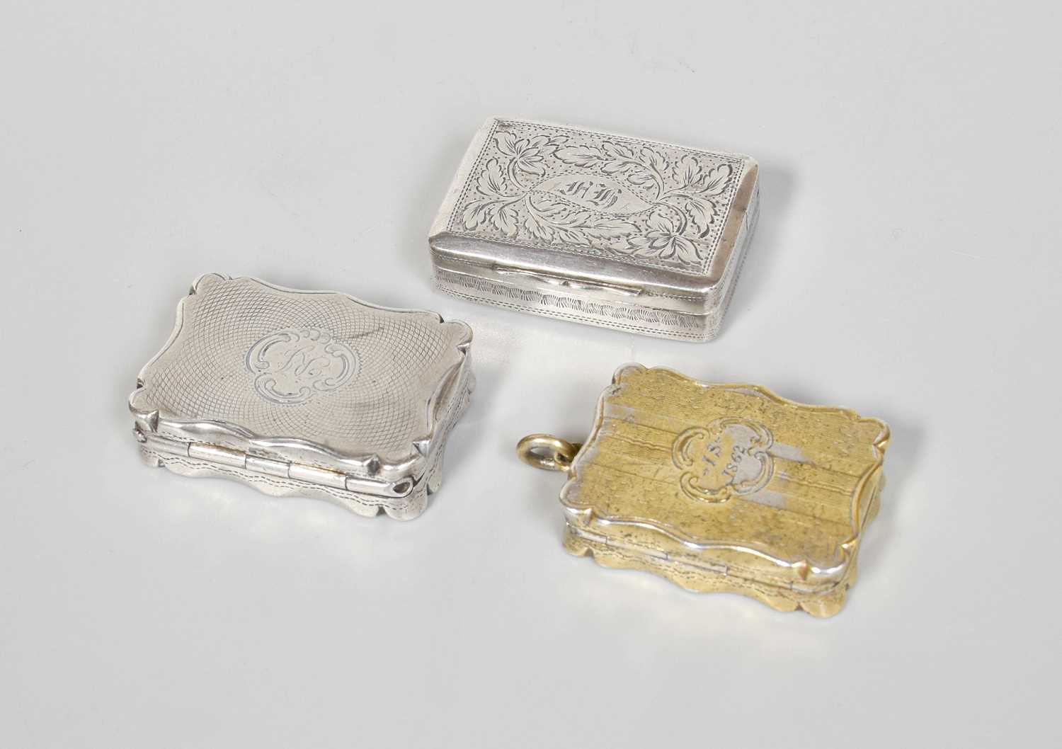 A George IV Silver Vinaigrette and Two Victorian Silver Vinaigrettes, One by Thomas Newbold,