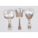 A George III Silver Caddy-Spoon, A George IV Silver Caddy-Spoon and a Victorian Silver Caddy-