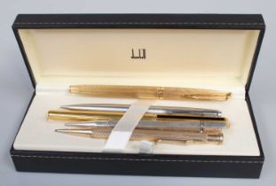 A Waterman Fountain Pen, the nib stamped 18k/750, a Dunhill fountain pen 14k nib and three
