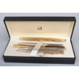 A Waterman Fountain Pen, the nib stamped 18k/750, a Dunhill fountain pen 14k nib and three