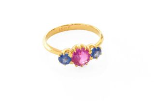 A Synthetic Sapphire Dress Ring, the round cut synthetic pink sapphire flanked by round cut