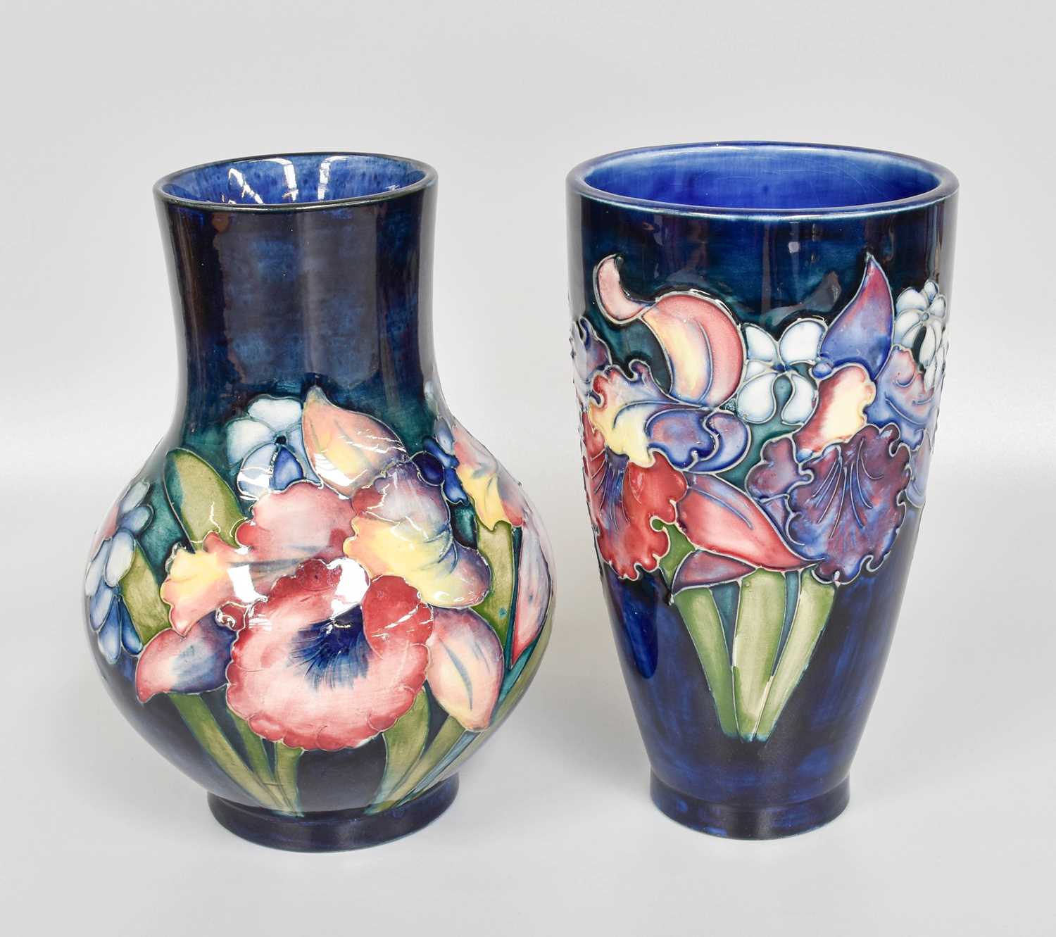 A Walter Moorcroft "Orchids and Spring Flowers" Pattern Vase, of tapering cylindrical form,