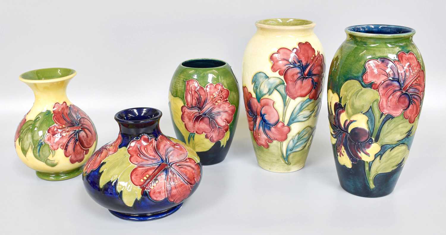 Five Walter Moorcroft "Hibiscus" Pattern Vases, impressed marks and two with painted signatures,