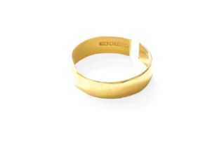 A 22 Carat Gold Band Ring, finger size T (approximately, band cut) Gross weight 3.8 grams.