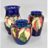 A Walter Moorcroft "Leaves and Berries" Pattern Vase, impressed mark and signed, 18.5cm high, Two