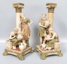 A Pair of Royal Dux Porcelain Figural Vases, modelled in the Classical style as a pair of ionic