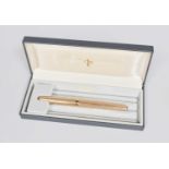 An Elizabeth II Gold Fountain-Pen, by Parker, London, 1968, 9ct, with an overall engine-turned