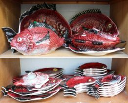 A Portuguese Faience Fish Service, 20th century, including naturalistically moulded tureens, serving