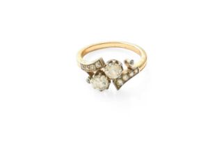 A Diamond Two Stone Twist Ring, the old cut diamonds in white claw settings, to diamond set twist