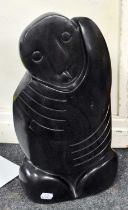 A Shona Carved Serpentine Statue, abstract figure 42cm high Some surface scuffs. No chips or cracks.