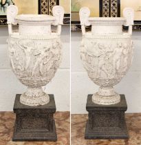 After the Antique a Pair of Composite Urns, modelled after the Townley Vase, raised on square