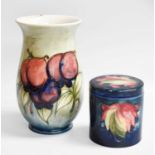 A William Moorcroft "Wisteria" Pattern Vase, 18.5cm high, a William Moorcroft "Leaf and Berry" jar
