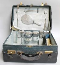 A Cased George V SilverMounted Dressing-Table Service, each piece engine-turned, engraved with
