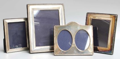 Three Elizabeth II Silver Photograph-Frames, comprising an oblong example with beaded border, 17.5cm